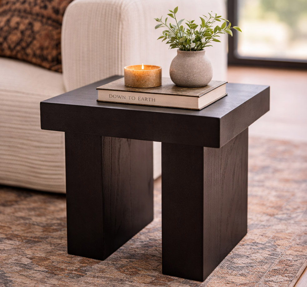 Side table styled with candle and plant